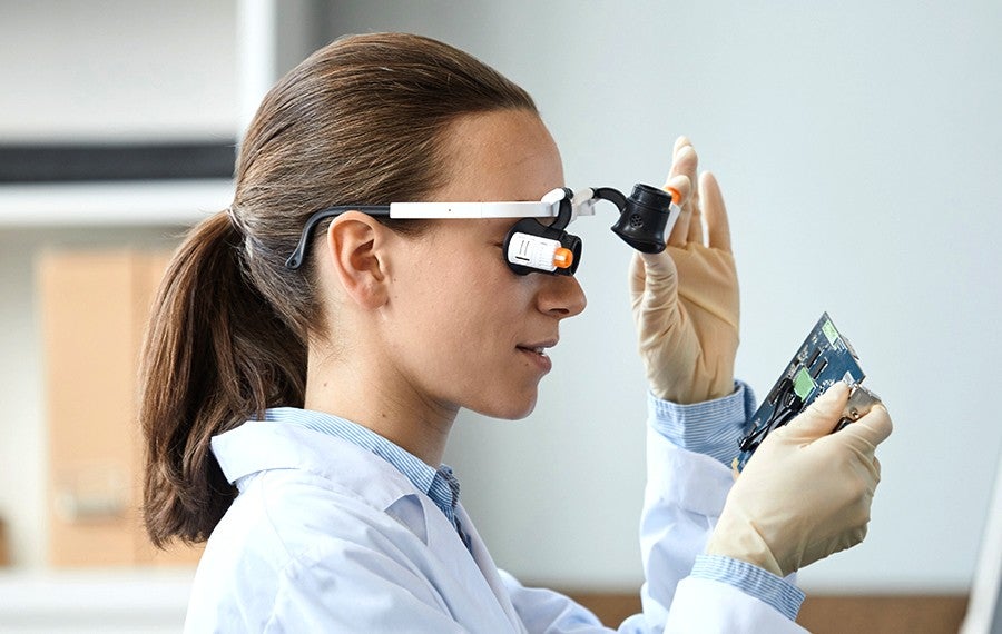 scientist inspecting a semiconductor