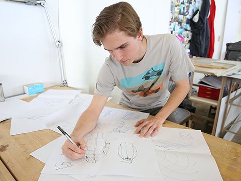 Students drawing in a sports product design class Students drawing in a sports product design class