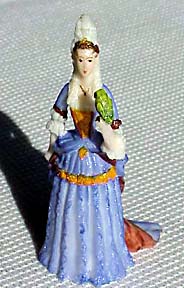 Lady of 1690 in a blue gown with parrot.