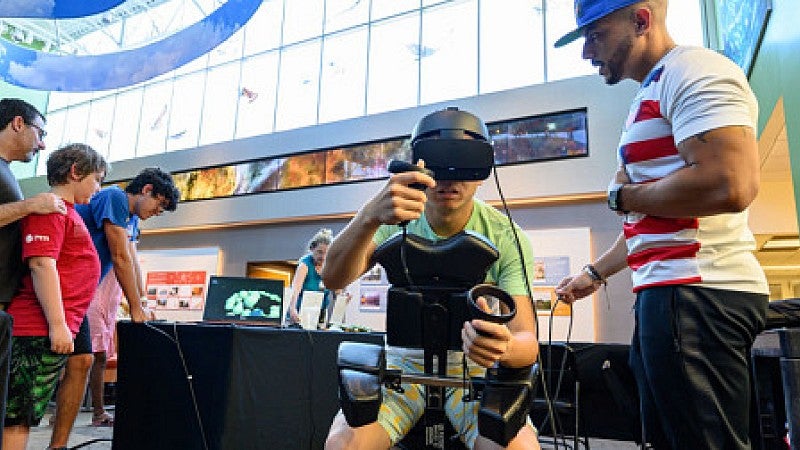 danny pimental with a student in a museum