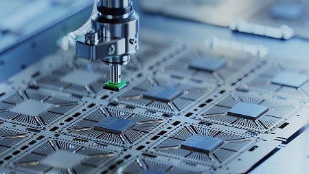 Close-up photo of a machine manufacturing semiconductors.